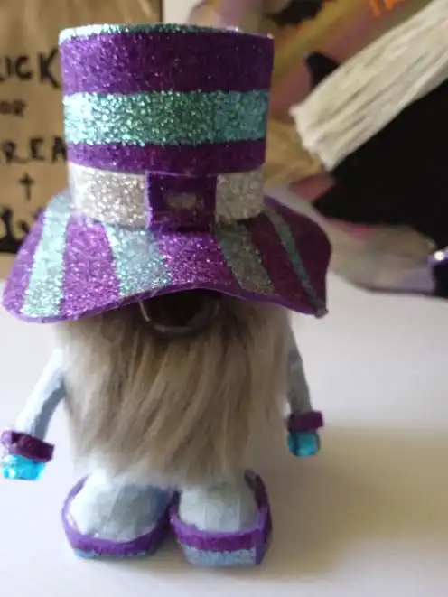 A Quirky Craft handmade gnome with a purple hat and a white beard